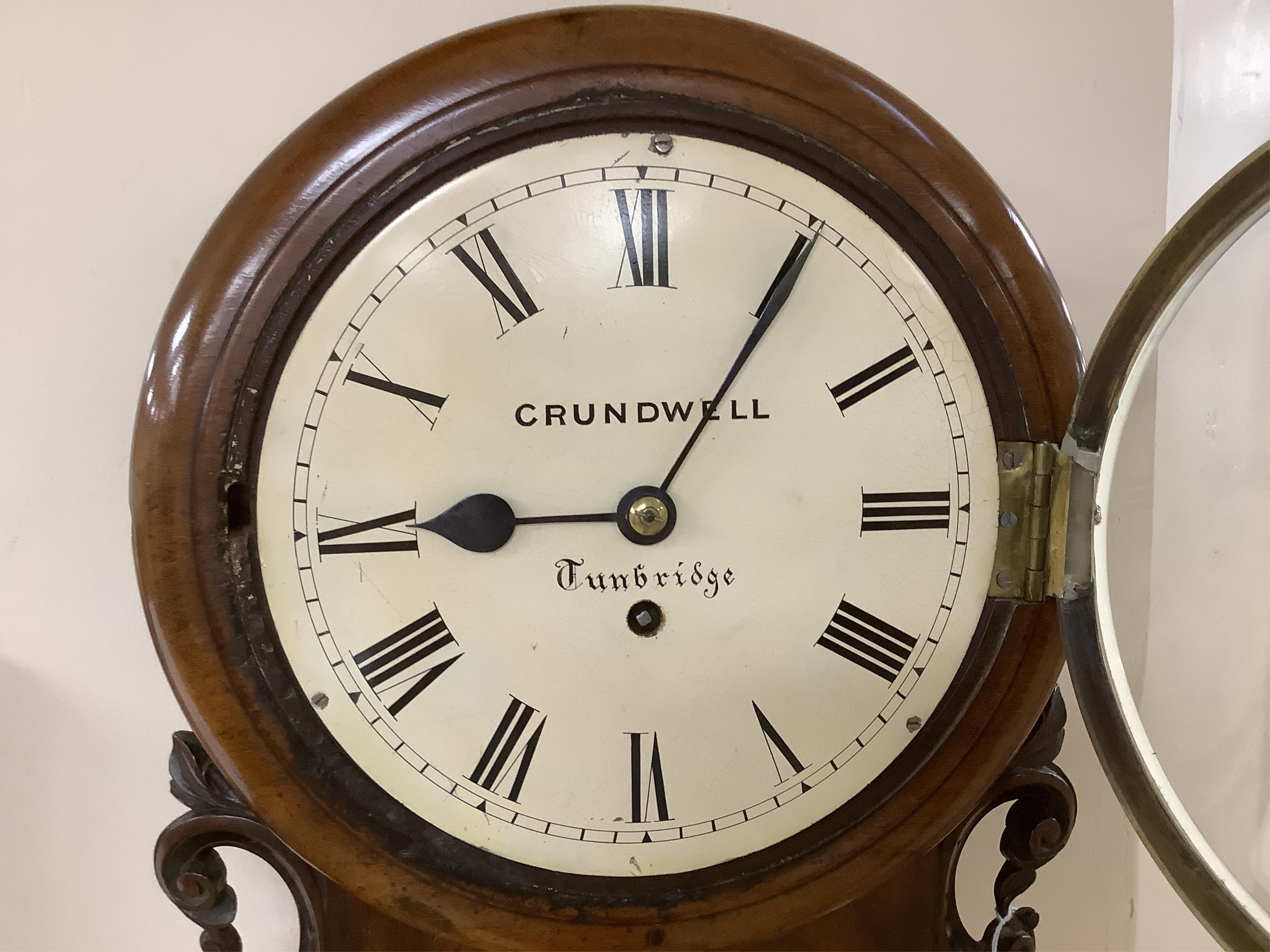 A mid 19th century small mahogany cased drop dial wall clock by Crundwell of Tunbridge, with key and pendulum, 37cm high. Condition - fair to good. Not tested as working